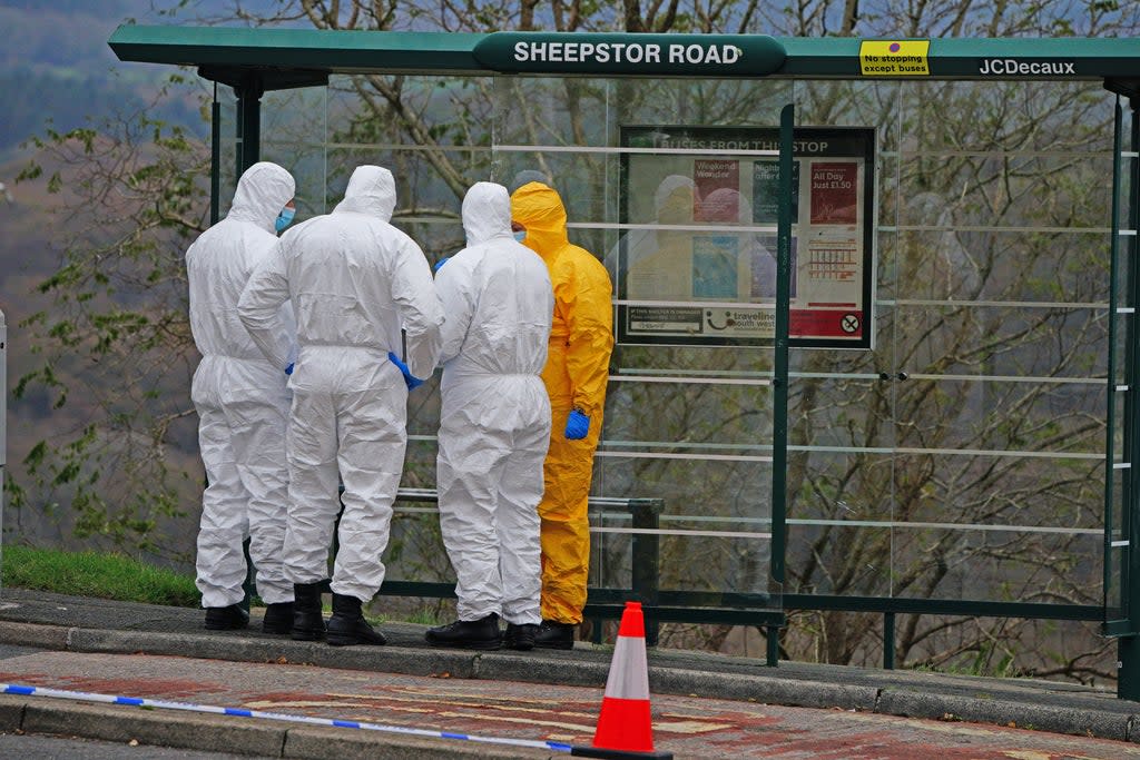 Forensic teams at the bus stop where Bobbi-Anne McLeod was last seen (Ben Birchall/PA) (PA Wire)