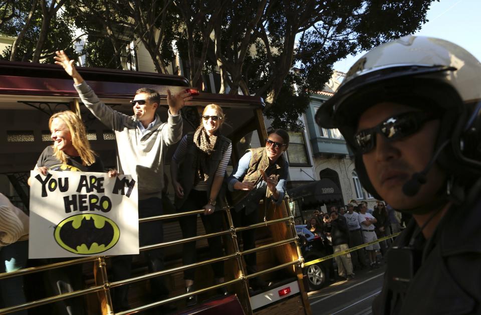 Fans of leukemia survivor Miles, aka "Batkid", cheer as part of a day arranged by the Make-A-Wish Foundation in San Francisco