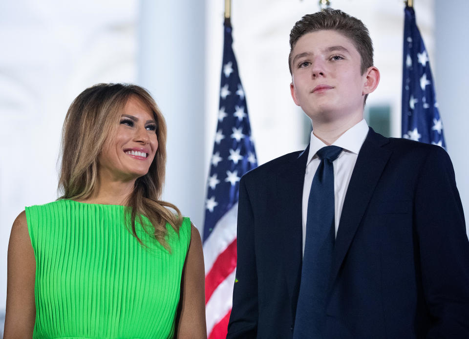 First lady Melania Trump (L) looks at her son Barron Trump after U.S. President Donald Trump delivered his acceptance speech for the Republican presidential nomination on the South Lawn of the White House August 27, 2020 in Washington, DC.