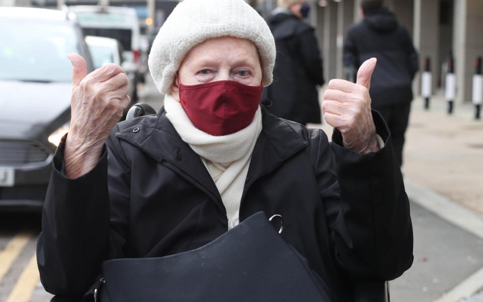 Mary Heaword, 99, gives the thumbs up after receiving the Covid-19 vaccination in Wembley - PA