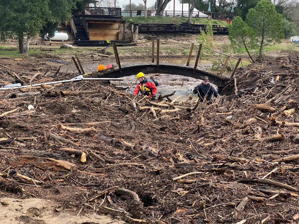 In this photo provided by San Luis Obispo County Sheriff's Office, rescuers resume their search on Wednesday, Jan. 11, 2023, for 5-year-old Kyle Doan, who was swept away Monday, Jan. 9, by floodwaters near San Miguel, Calif. (San Luis Obispo County Sheriff's Office via AP)