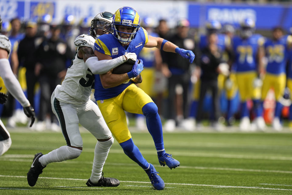 Los Angeles Rams wide receiver Cooper Kupp, right, is dragged down by Philadelphia Eagles cornerback Bradley Roby during the first half of an NFL football game Sunday, Oct. 8, 2023, in Inglewood, Calif. (AP Photo/Gregory Bull)