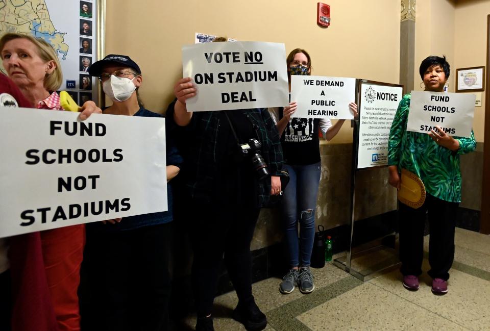 Stand Up Nashville demonstrators outside the Metro Council chambers on Tuesday, April 18, 2023, in Nashville, Tenn. The group could not get into the council meeting because it was filled with Tennessee Titans stadium proponents. Stand Up Nashville protestors wanted to call attention to gun violence, healthcare issues and workers’ rights and ask the Metro Council to have a public hearing about the issues.