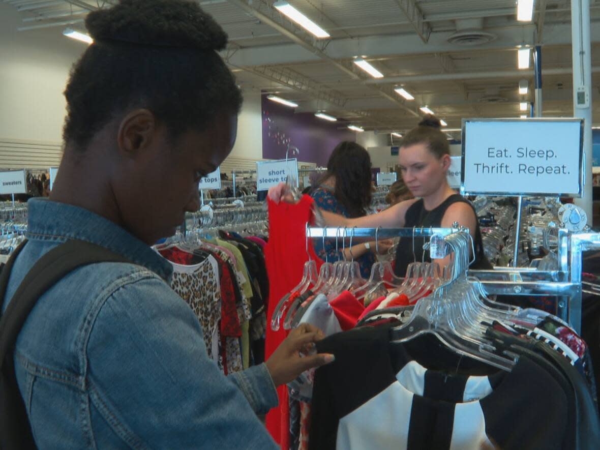 The Women in Need Society hosted its first-ever thrift crawl event Saturday, busing shoppers to three of its thrift store locations across the city. (Helen Pike/CBC - image credit)