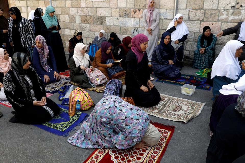 Palestinian women outside the compound known to Muslims as the Noble Sanctuary, and to Jews as Temple Mount: Reuters