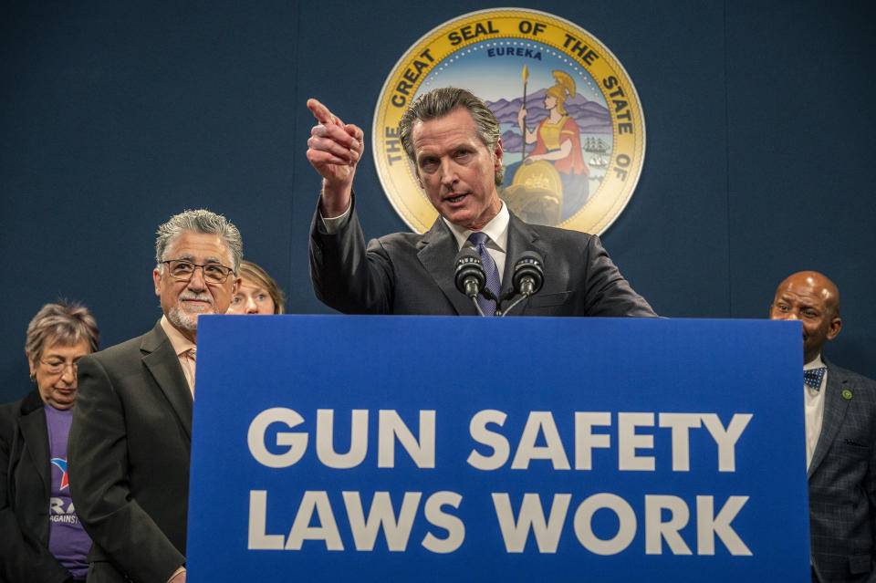 California Gov. Gavin Newsom answers questions at a press conference to push for the passing of Senate Bill 2 in Sacramento, Calif., on Wednesday, Feb. 1, 2023. Newsom wants to limit where people can carry concealed guns. His Wednesday endorsement of legislation follows several high profile mass shootings that left dozens dead across the state in January. The proposal would ban people from carrying concealed guns in churches, public libraries, private businesses, and other places. (Renée C. Byer/The Sacramento Bee via AP)