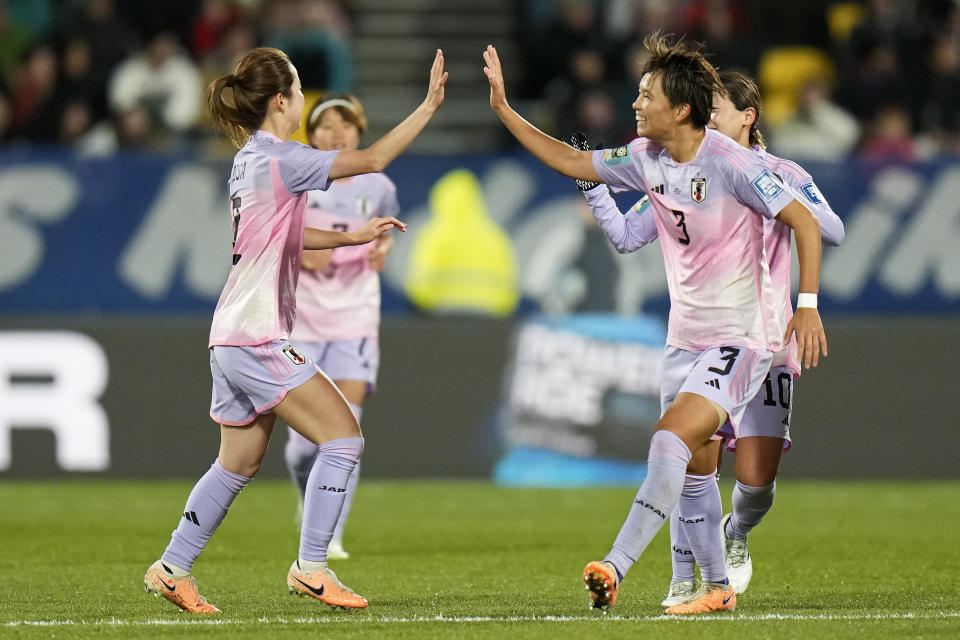 Japan's Risa Shimizu, left, celebrates with Japan's Moeka Minami, right, after she scored Japan's second goal during the Women's World Cup second round soccer match between Japan and Norway in Wellington, New Zealand, Saturday, Aug. 5, 2023. (AP Photo/Alessandra Tarantino)