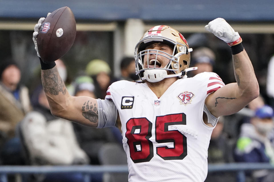 San Francisco 49ers tight end George Kittle (85) celebrates after he scored a touchdown against the Seattle Seahawks during the first half of an NFL football game, Sunday, Dec. 5, 2021, in Seattle. (AP Photo/Elaine Thompson)