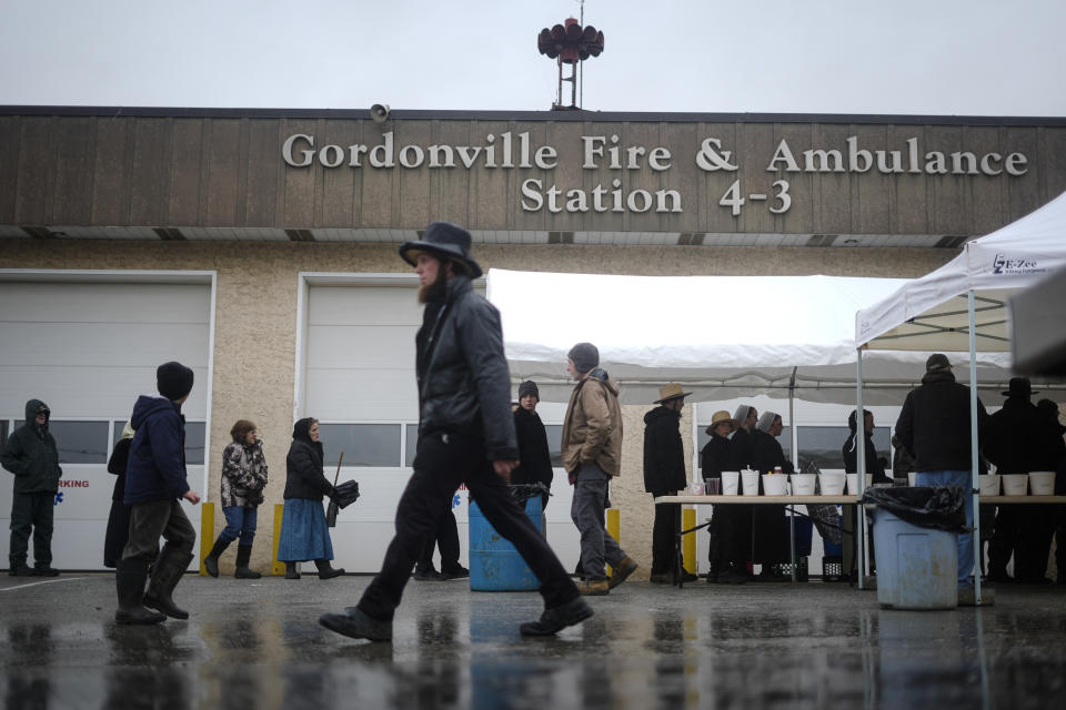 People wait in line to purchase food at the 56th annual mud sale to benefit the local fire department in Gordonville, Pa., Saturday, March 9, 2024. Mud sales are a relatively new tradition in the heart of Pennsylvania's Amish country, going back about 60 years and held in early spring as the ground begins to thaw but it's too early for much farm work. (AP Photo/Matt Rourke)