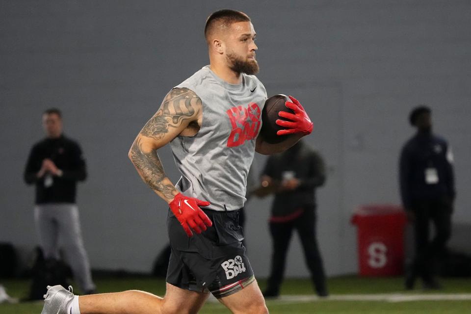 Mar 20, 2024; Columbus, Ohio, USA; Ohio State Buckeyes tight end Cade Stover runs after making a catch during Pro Day at the Woody Hayes Athletic Center.