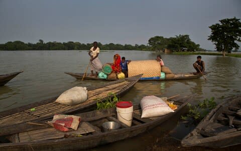 Some 4.5 million have been affected by the flooding in Assam - Credit: AP Photo/Anupam Nath