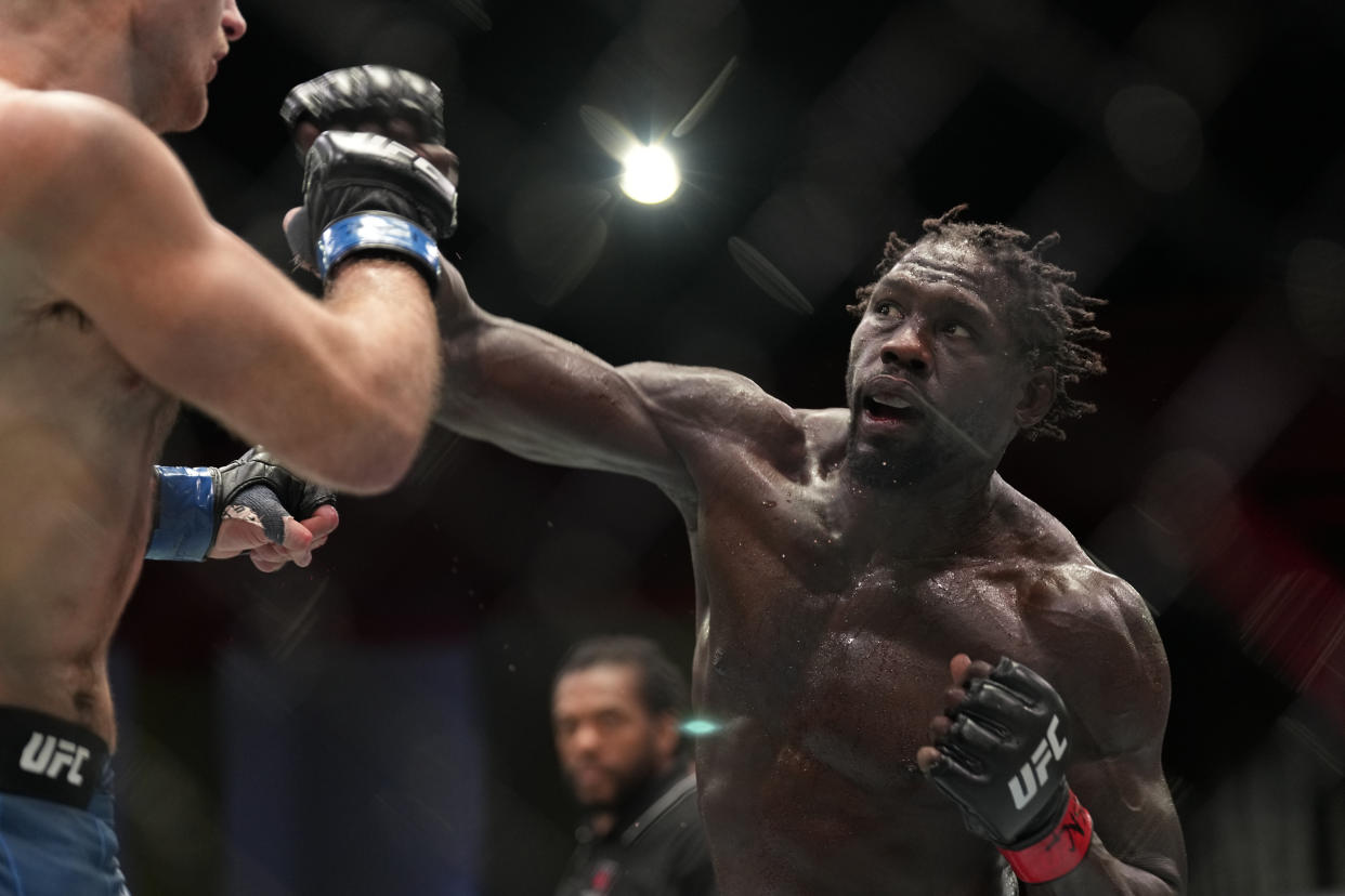 LAS VEGAS, NV - DECEMBER 17: (R-L) Jared Cannonier punches Sean Strickland in their Middleweight fight during the UFC Vegas 66 event at UFC APEX on December 17, 2022 in Las Vegas, Nevada, United States. (Photo by Louis Grasse/PxImages/Icon Sportswire via Getty Images)