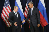 <p>Russian President Vladimir Putin (L) and U.S. President Barack Obama shake hands for the cameras before the start of a bilateral meeting at the United Nations headquarters September 28, 2015 in New York City. Putin and Obama are in New York City to attend the 70th anniversary general assembly meetings. (Chip Somodevilla/Getty Images) </p>