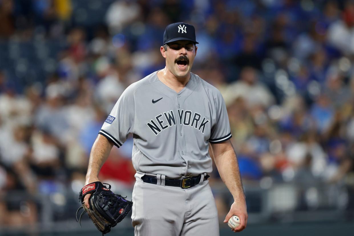 New York Yankees pitcher Carlos Rodon reacts after the Kansas City Royals scored a run during the first inning of a baseball game in Kansas City, Mo., Friday, Sept. 29, 2023. (AP Photo/Colin E. Braley)