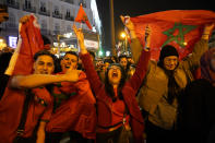 Morocco fans celebrate in the central Puerta del Sol in Madrid, Spain, Tuesday, Dec. 6, 2022. Morocco beat Spain on penalties during a round of 16 World Cup soccer tournament in Qatar. (AP Photo/Andrea Comas)