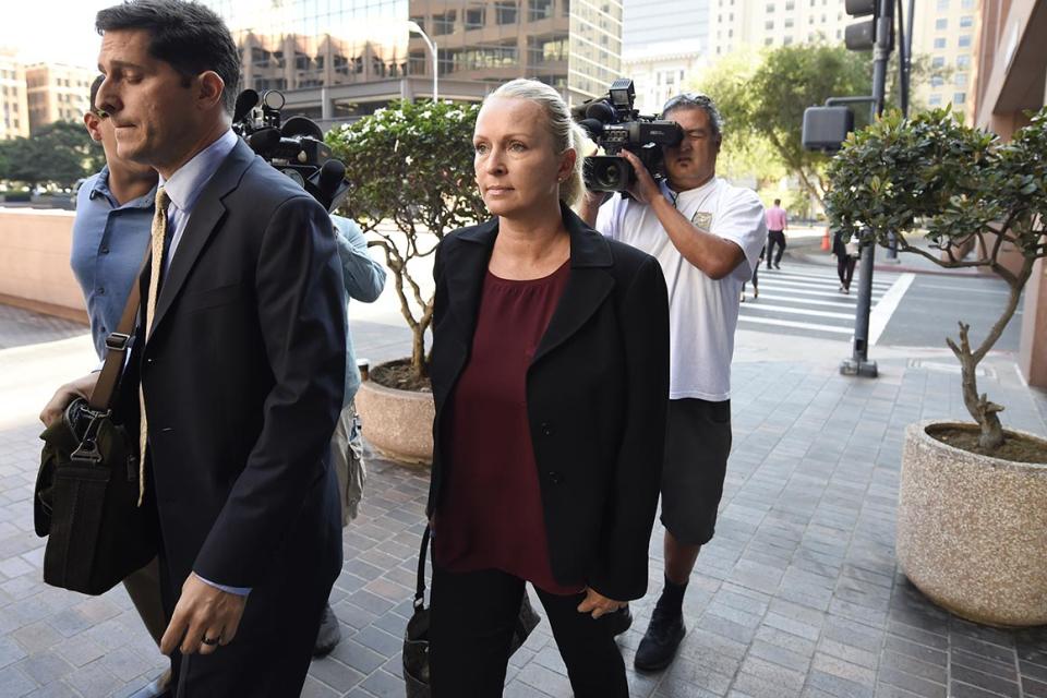 Margaret Hunter, center, the wife of Rep. Duncan Hunter, arrives for an arraignment hearing in San Diego on Thursday, Aug. 23, 2018.