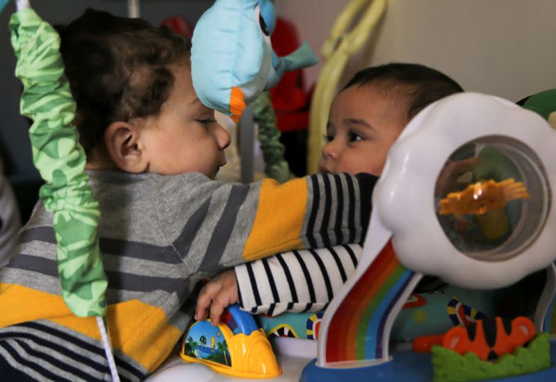 Mohamed Abdallah's biological son Soliman and Dawood, the orphan Mohamed sponsors, play together in their home in Cairo