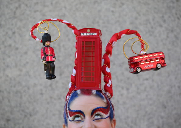 Josie Todd wears a hair sculpture depicting a London phone box on August 9, 2012 in London, England. Created by Catalonian performance artists Osadia, these sculpted hair pieces are a tribute the success of Team GB in the London 2012 Olympics and will be touring London as part of Showtime a large London outdoor arts festival. (Photo by Peter Macdiarmid/Getty Images)