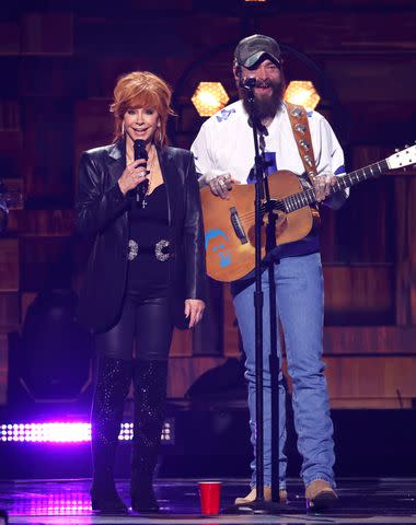 <p>Jason Kempin/Getty</p> Reba McEntire and Post Malone during a surprise performance at the ACM Awards on May 16, 2024 in Frisco, Texas