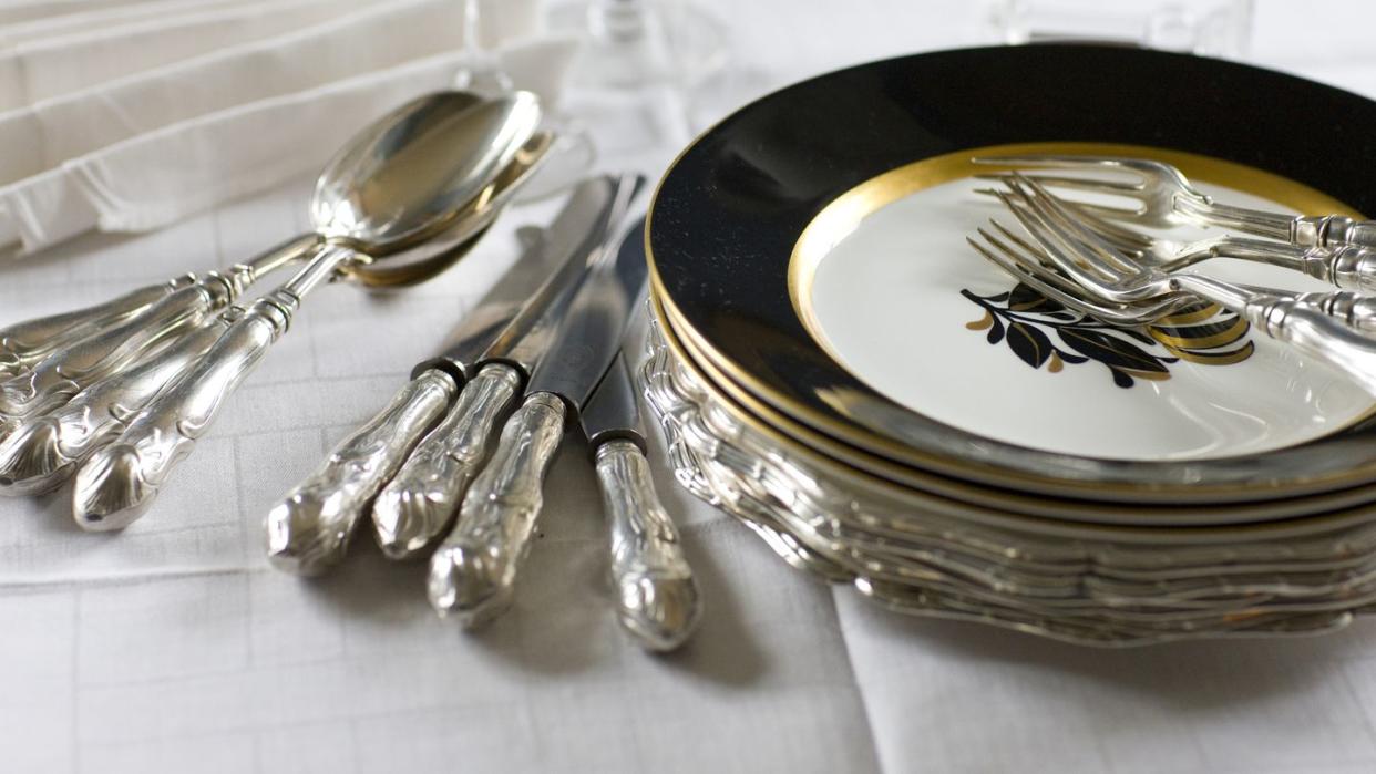 elegant cutlery and crockery on table