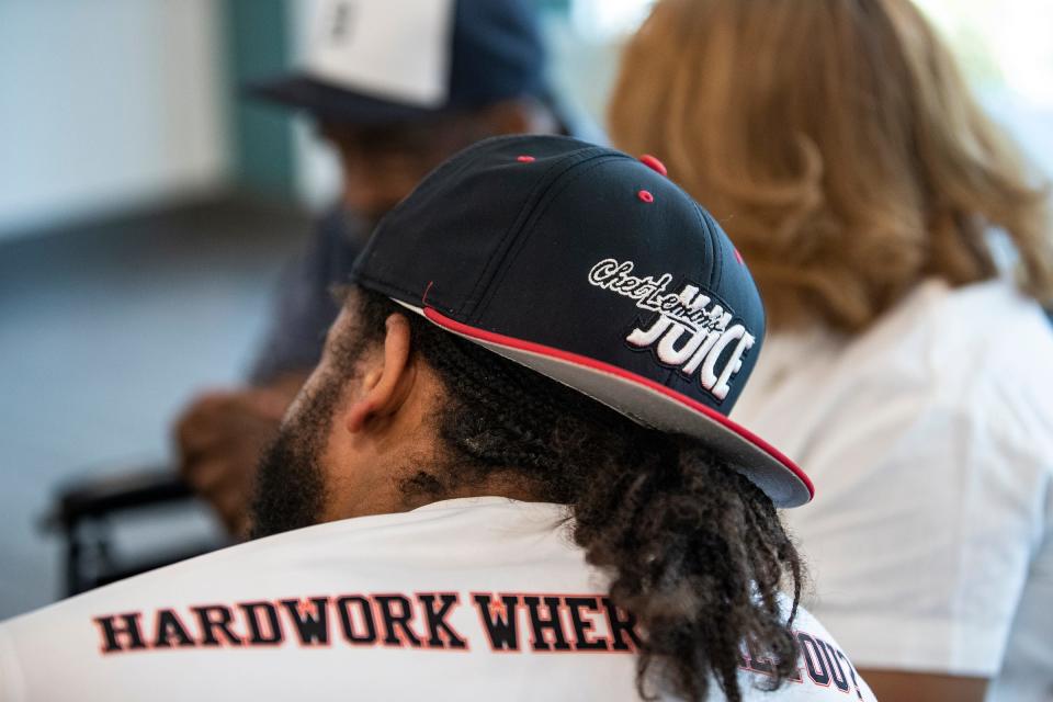 Chet Lemon's son Marcus Lemon wears a hat of his father's youth baseball team, Chet Lemon's Juice,  during a family get-together at Encompass Health Rehabilitation Hospital in Clermont, Fla., on Thursday, May 23, 2024.