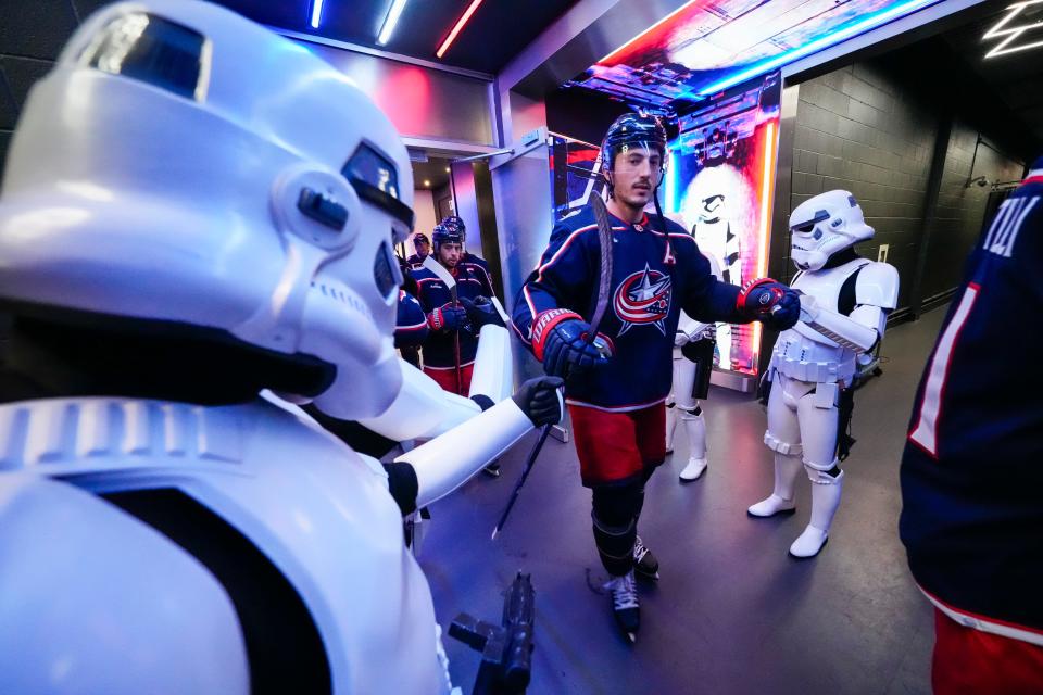 Oct 20, 2023; Columbus, Ohio, USA; Columbus Blue Jackets defenseman Zach Werenski (8) is greeted by Storm Troopers as he exits the locker room during Star Wars Night prior to the NHL hockey game against the Calgary Flames at Nationwide Arena.