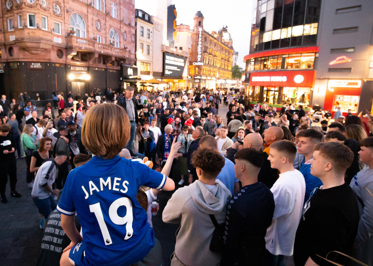 England fans singing in Leicester Square, central London, the evening before the England football team playing in the UEFA Euro 2020 Final. Picture date: Saturday July 10, 2021.