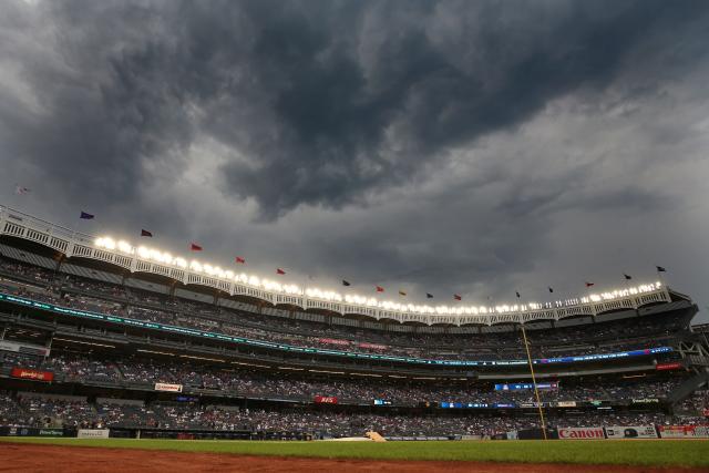 Baseball opener delayed by rain