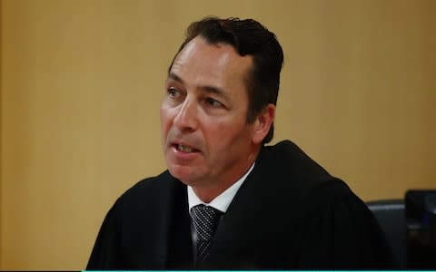 Judge Evangelos Thomas speaks as a man accused of Grace Millane's murder appears in court in Auckland - Credit: Getty