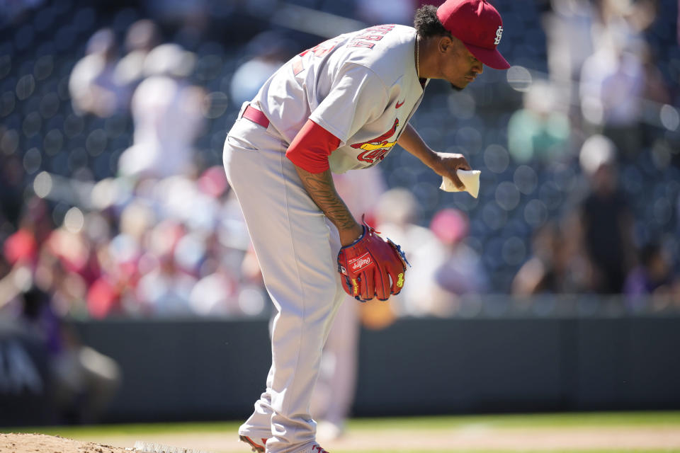 St. Louis Cardinals relief pitcher Genesis Cabrera reacts after giving up a three-run home run to Colorado Rockies' Brendan Rodgers in the seventh inning of a baseball game Thursday, Aug. 11, 2022, in Denver. (AP Photo/David Zalubowski)