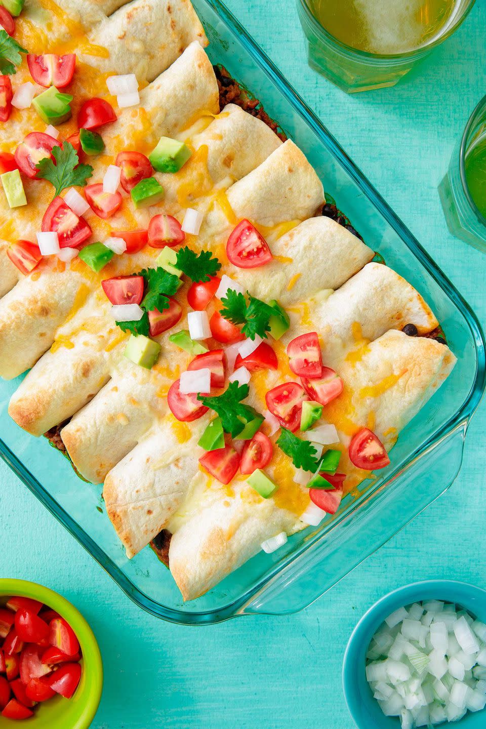 <p>These go great with margaritas.</p><p>Get the recipe from <a href="https://www.delish.com/cooking/recipe-ideas/a22790411/beef-enchiladas-recipe/" rel="nofollow noopener" target="_blank" data-ylk="slk:Delish;elm:context_link;itc:0;sec:content-canvas" class="link ">Delish</a>.</p>