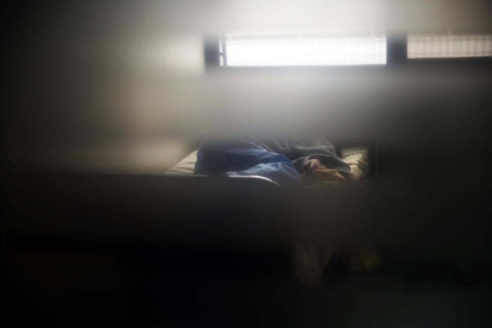 A child lays in his bed at the pediatric unit of the Robert Debre hospital, in Paris, France, Wednesday, March 3, 2021. France's busiest pediatric hospital has seen a doubling in the number of children and young teenagers requiring treatment after attempted suicides. Doctors elsewhere report similar surges, with children — some as young as 8 — deliberately running into traffic, overdosing on pills and otherwise self-harming. (AP Photo/Christophe Ena)