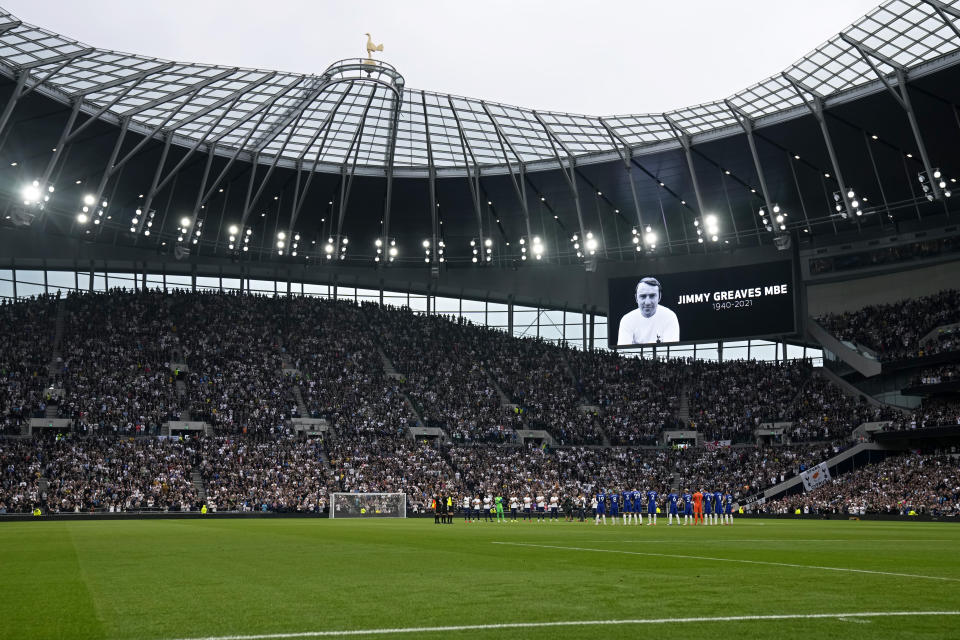 Players stand on the pitch applauding in a tribute to former player Jimmy Greaves before the English Premier League soccer match between Tottenham Hotspur and Chelsea at the Tottenham Hotspur Stadium in London, England, Sunday, Sep. 19, 2021. Greaves, one of England's greatest goal-scorers who was prolific for Tottenham, Chelsea and AC Milan has died. He was 81. Greaves was the all-time record scorer for Tottenham, which announced his death on Sunday. (AP Photo/Matt Dunham)