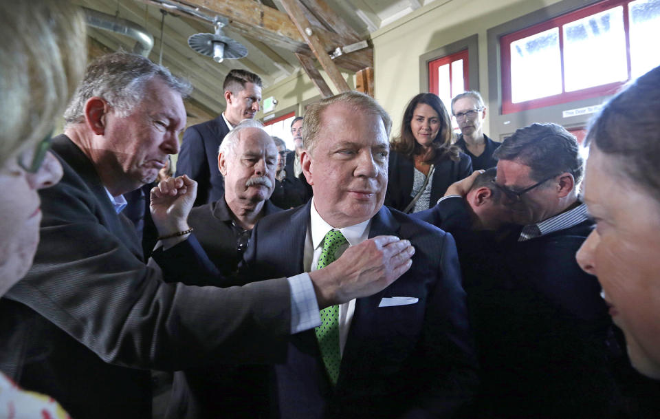 <p>Seattle Mayor Ed Murray is surrounded and embraced by supporters, some in tears, after reading a statement saying that he is dropping his re-election bid for a second term , May 9, 2017, in Seattle. Last month a man filed a lawsuit claiming he was sexually abused by Murray in the 1980s when he was a teenager. Three others made similar allegations, and all were vehemently denied by Murray. (Photo: Elaine Thompson/AP) </p>