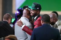 Jun 23, 2016; New York, NY, USA; Jaylen Brown (California) hugs supporters after being selected as the number three overall pick to the Boston Celtics in the first round of the 2016 NBA Draft at Barclays Center. Mandatory Credit: Jerry Lai-USA TODAY Sports