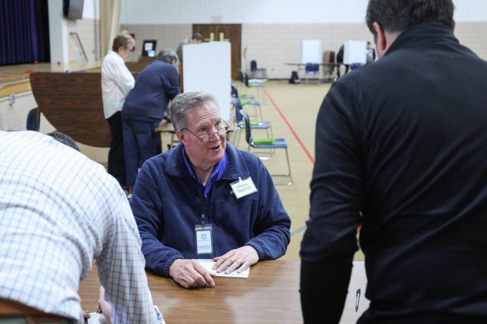 Chris Propst greets voters as they enter Philadelphia Presbyterian Church during the primary election in Charlotte, NC on Tuesday, March 5, 2024.