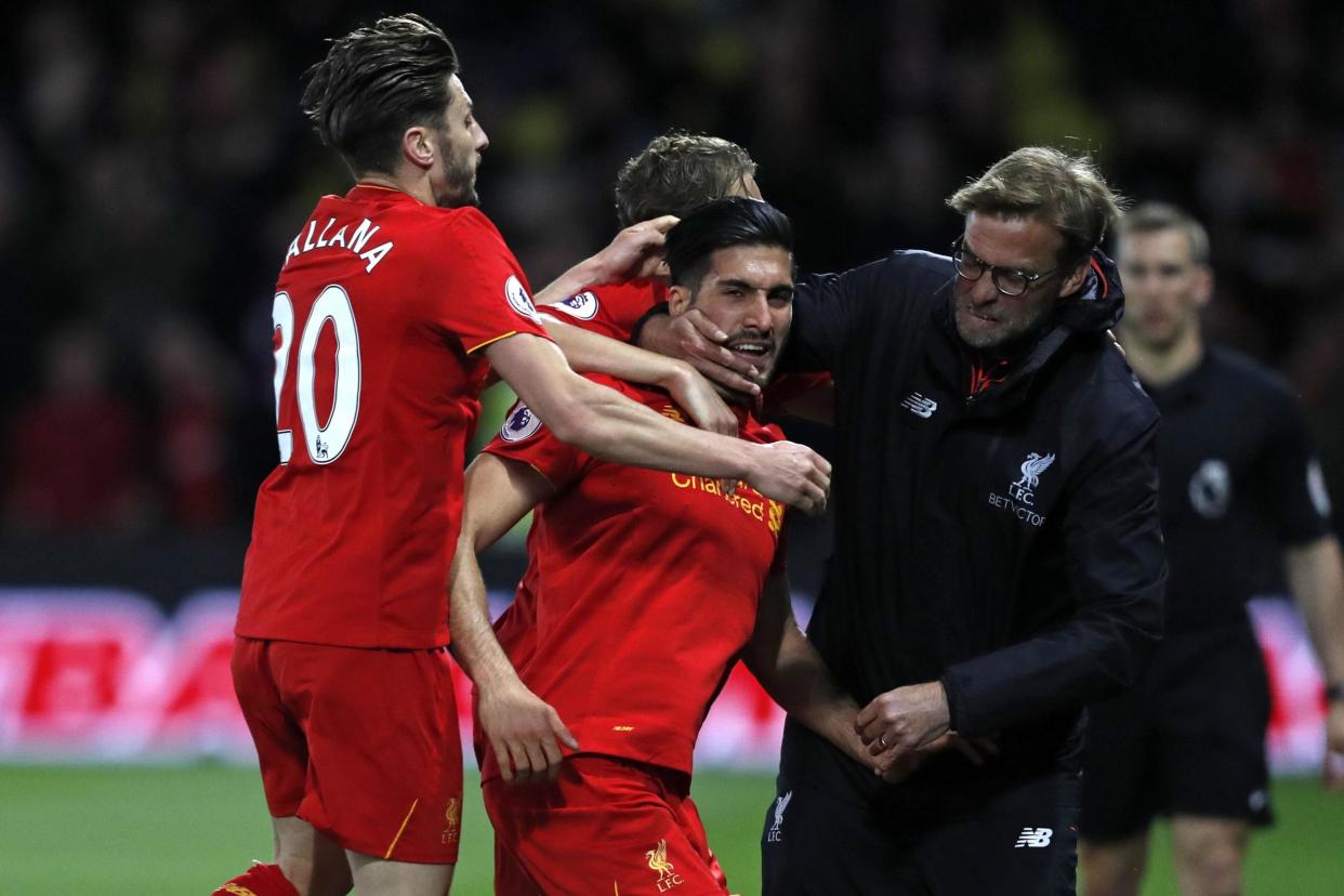 Jurgen Klopp celebrates with Emre Can after the player's stunning goal: Getty