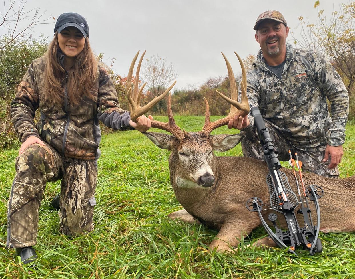 Ellie and Kevin Miller pose with the 10-point buck that the Hiland High School sophomore shot in late October in Licking County with a crossbow. The buck, nicknamed Captain Hook, had a storied life and grew to 184 1/2 inches as scored by Buckmasters.