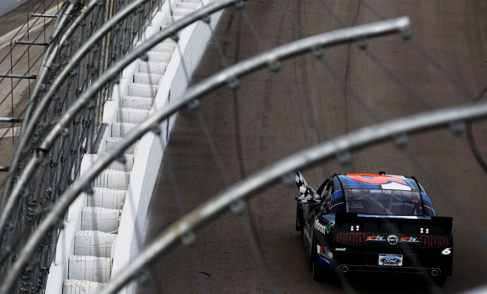 LAS VEGAS, NV - MARCH 10: Ricky Stenhouse Jr., driver of the #6 Ford EcoBoost Ford, celebrates with the checkered flag after winning the NASCAR Nationwide Series Sam's Town 300 at Las Vegas Motor Speedway on March 10, 2012 in Las Vegas, Nevada. (Photo by Tom Pennington/Getty Images)