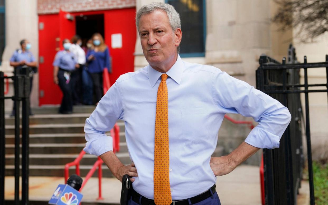 Mr de Blasio announced that all of his staff, including his wife and himself, must take a week of unpaid leave - John Minchillo /AP