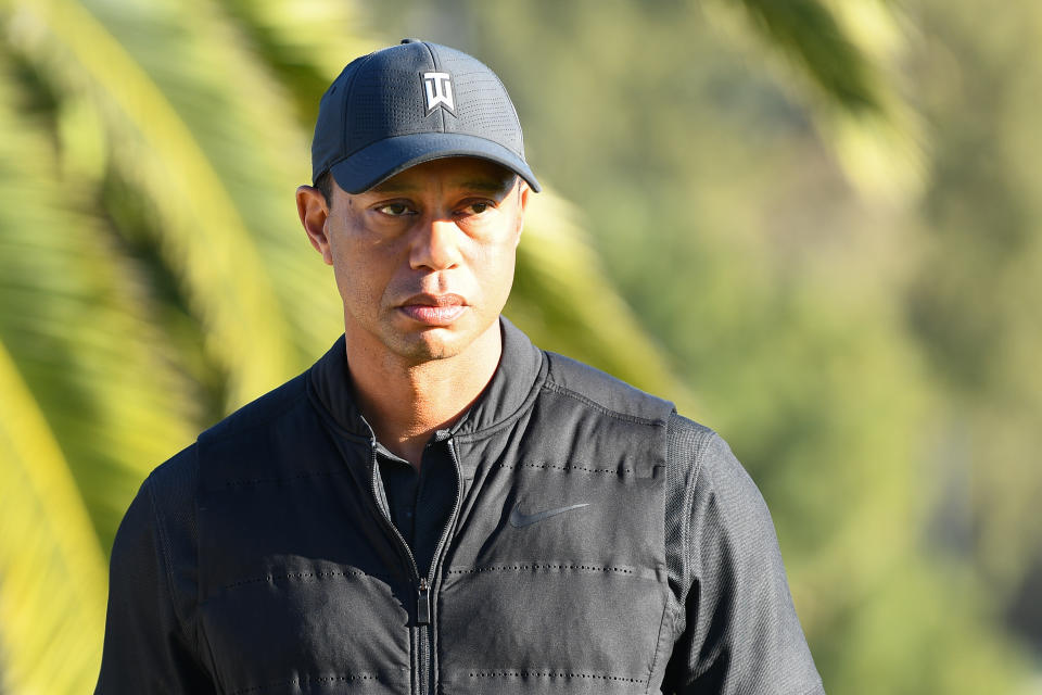 Tiger Woods looks on from the 18th hole during the final round of The Genesis Invitational golf tournament at the Riviera Country Club in Pacific Palisades, CA on February 21, 2021. The tournament was played without fans due to the COVID-19 pandemic.(Photo by Brian Rothmuller/Icon Sportswire via Getty Images)