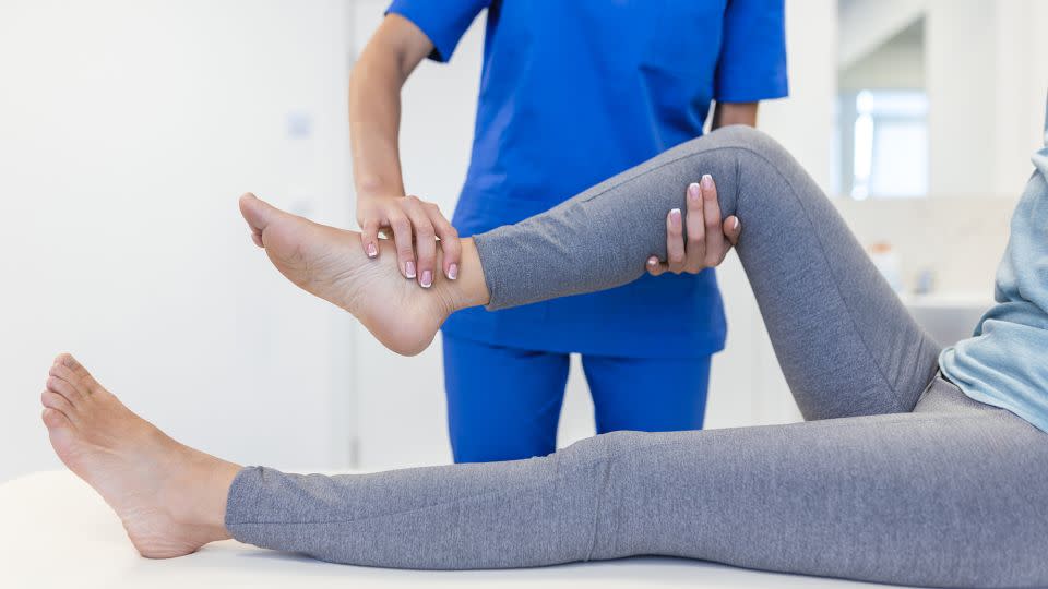 People should check with their doctor or physical therapist before going to stretch sessions. - stefanamer/iStockphoto/Getty Images