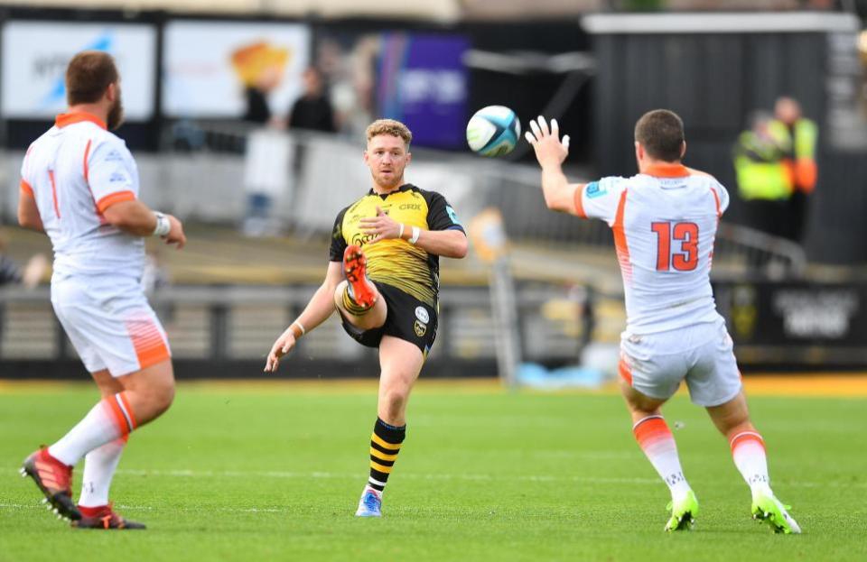 South Wales Argus: KICK: Angus O'Brien chips over the top for the Dragons against Edinburgh