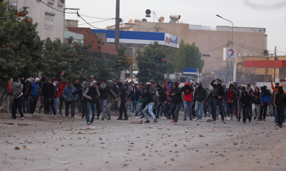 <p>Protesters throw stones during demonstrations against rising prices and tax increases, in Tebourba, Tunisia, Jan. 9, 2018. (Photo: Zoubeir Souissi/Reuters) </p>