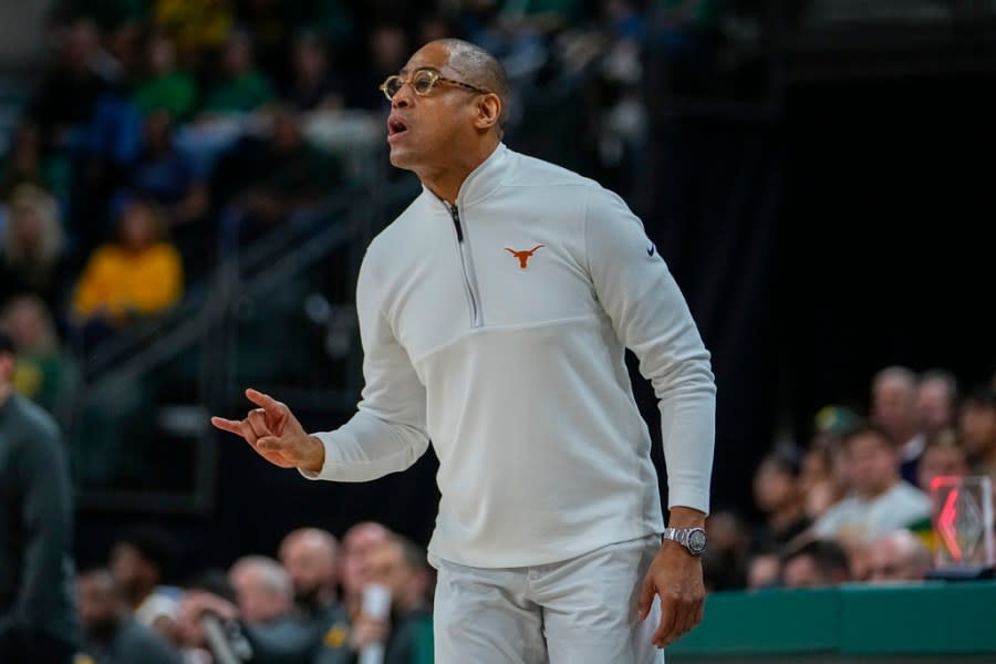 Texas head coach Rodney Terry talks to his team during the first half of an NCAA college basketball game against Baylor, Monday, March 4, 2024, in Waco, Texas. (AP Photo/Julio Cortez)