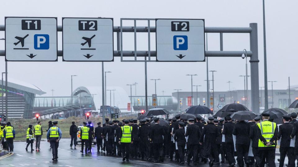 Aer Lingus pilots marching at Dublin airport as part of a dispute over pay