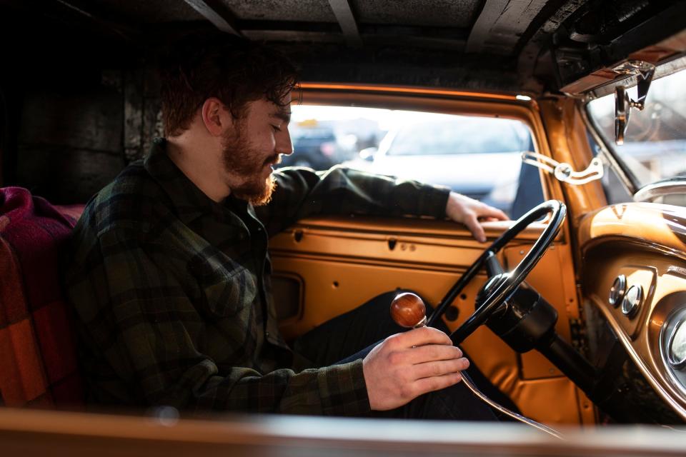 Logan Kucharek and his 1932 Ford with flathead V8 engine at the Brothers Custom Automotive in Troy on March 1, 2022.