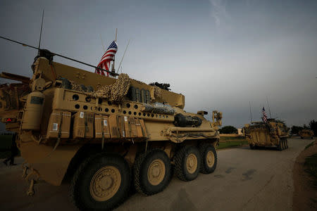 U.S military vehicles drive in the town of Darbasiya next to the Turkish border, Syria April 28, 2017. REUTERS/Rodi Said