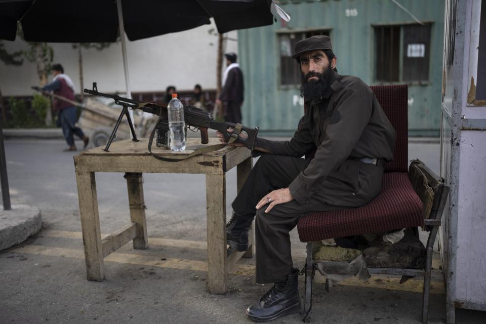 A Taliban soldier holds a machine gun at a check point in Kabul, Afghanistan, Tuesday, June 20, 2023. (AP Photo/Rodrigo Abd)