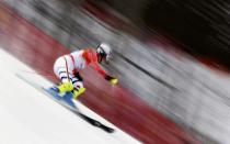 Germany's Maria Hoefl-Riesch speeds down the course during the first run of the women's alpine skiing slalom event at the 2014 Sochi Winter Olympics at the Rosa Khutor Alpine Center February 21, 2014. REUTERS/Dominic Ebenbichler (RUSSIA - Tags: SPORT SKIING OLYMPICS TPX IMAGES OF THE DAY)